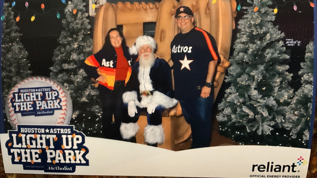 Lisbet Newton & Mike Acosta with Santa Claus at the Houston Astros Light up the Park