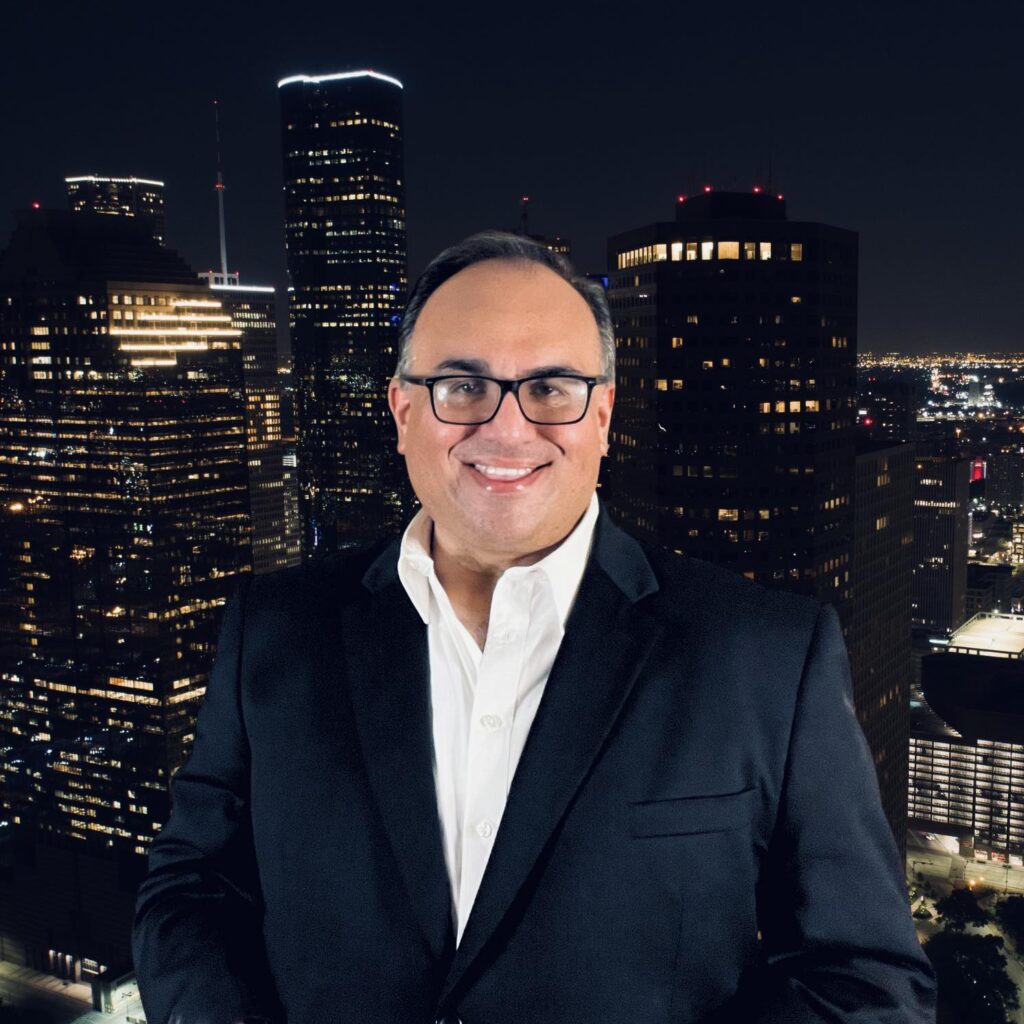 Mike Acosta in front of the Houston skyline