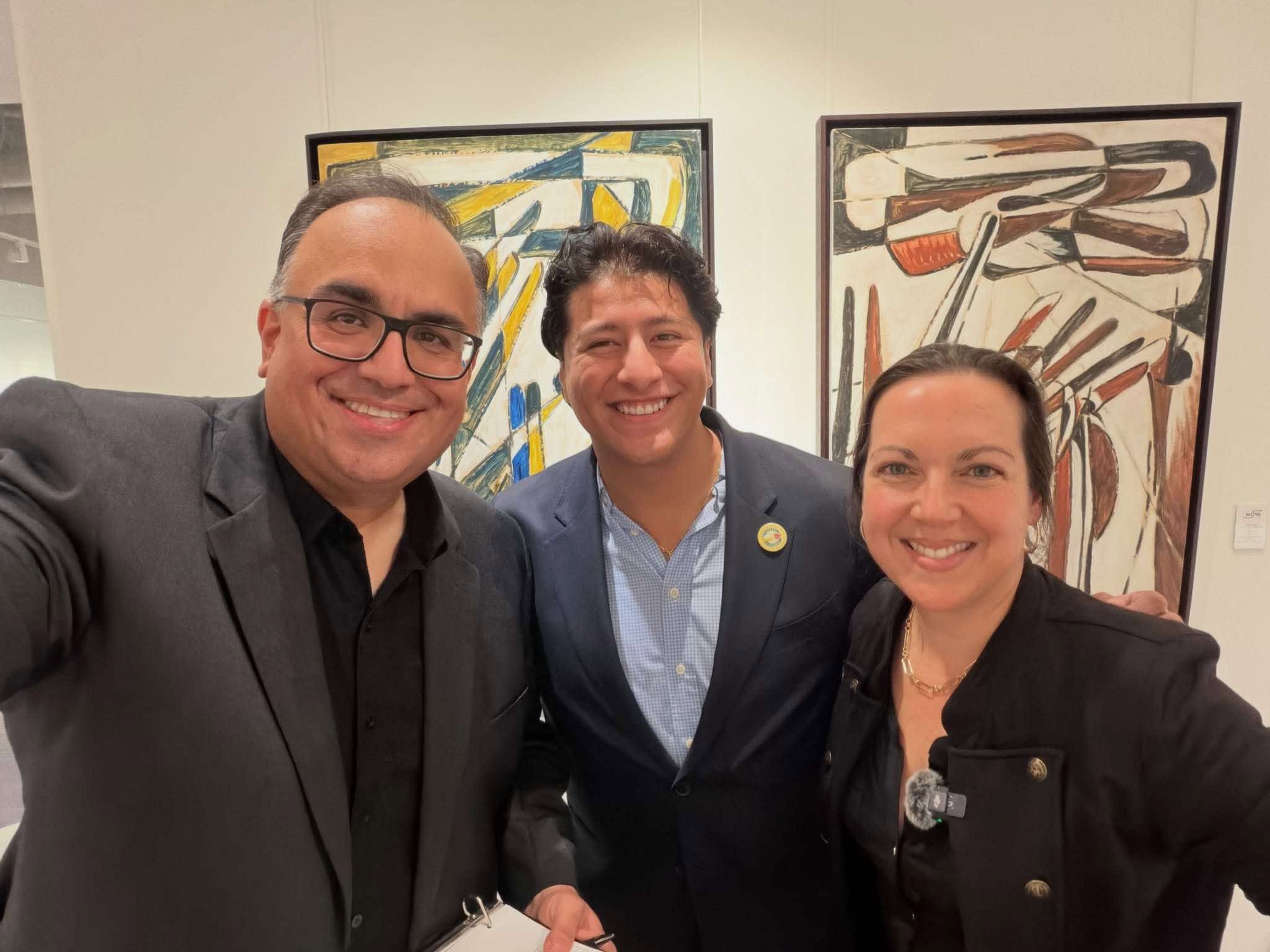 Mike Acosta, Ronaldo Salgado and Lisbet Newton smiling together at the Arrival Awards kickoff.