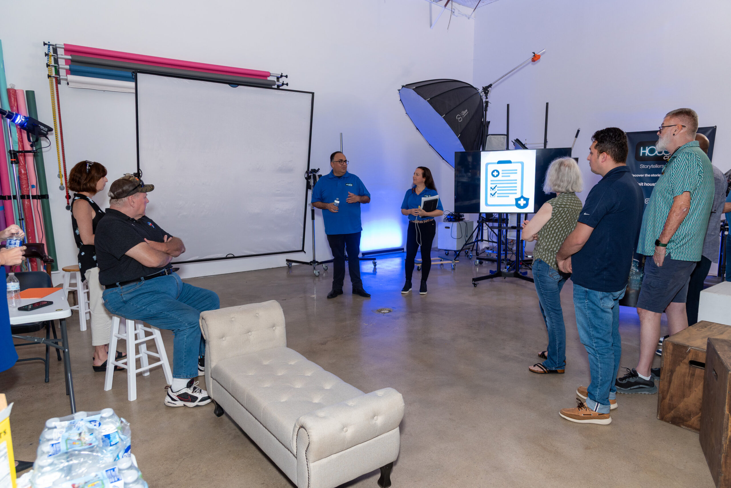 Attendees gather around two presenters inside West Loop Rental Studio at the October 15 Houston City Beat event.