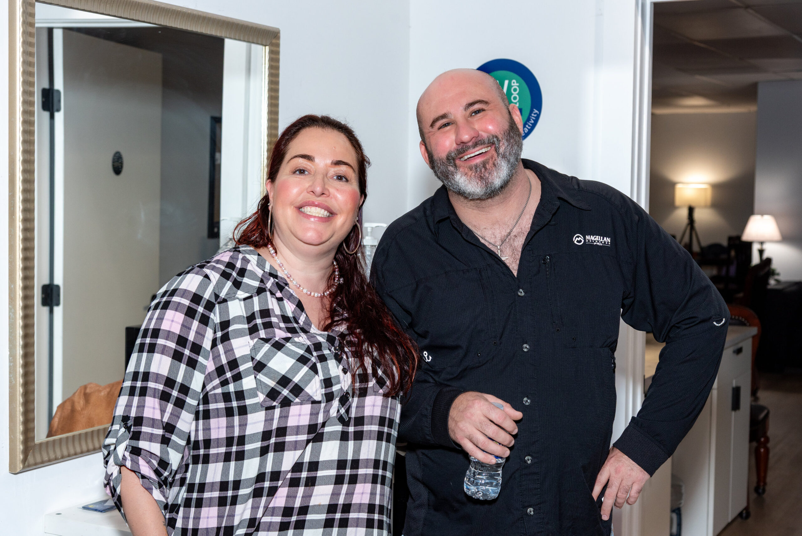 Two attendees smiling for a photo at the October 15 business mixer.